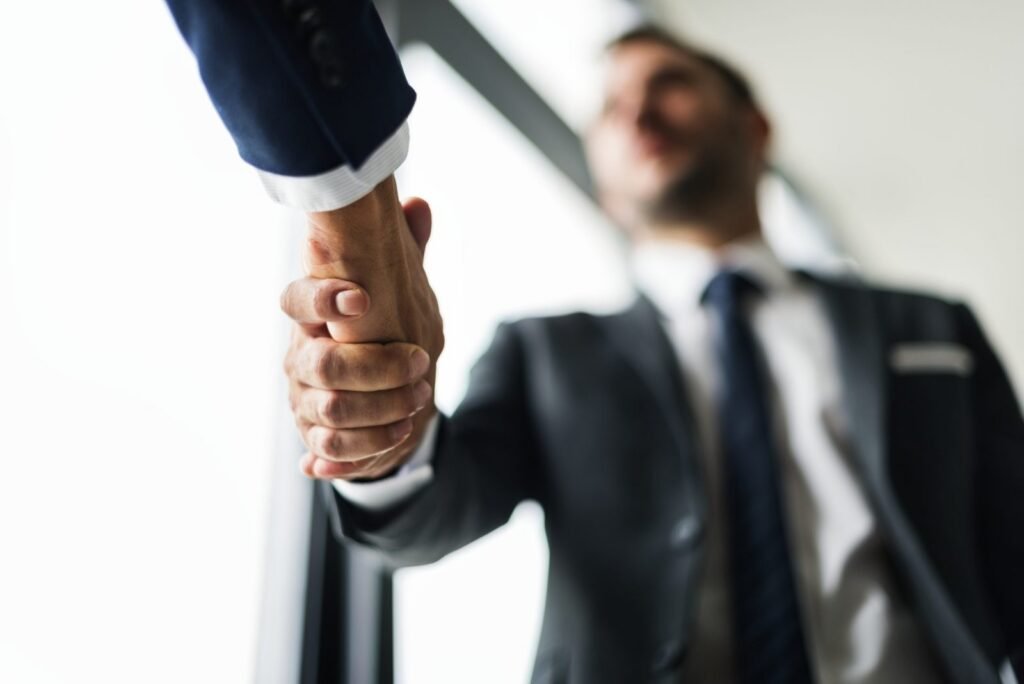 Two business partners shaking hands